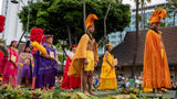 Members of the Aloha Festivals’ royal court take part in the 2022 Aloha Festivals Floral Parade. They are dressed in cloaks and helmets that were commonly worn by Hawaii’s chiefs.
