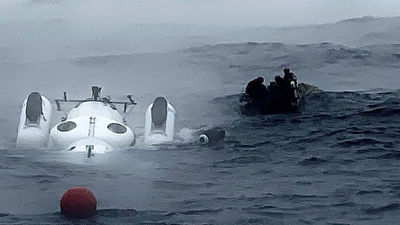 The front of the platform holding the submersible Titan went underwater for unknown reasons during an OceanGate Expedition mission last month. A crew, including OceanGate's CEO, Stockton Rush, prepared to dive under it to raise it.