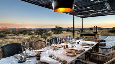Each of Loapi's private safari homes features an open-air dining area overlooking the Kalahari.