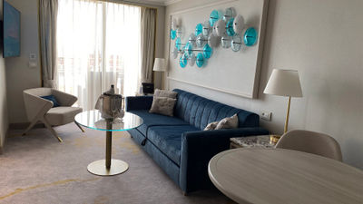 The Sapphire Veranda Suite on the Crystal Serenity combines two rooms to add a living room area with a couch and table.